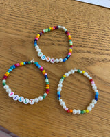 The Maxi Round ‘Pearl' Personalised Name Bracelet with multi coloured beads (made to order) - Petite Chou